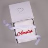 White personalised Christmas stocking folded in open One Little Day gift box with white ribbon bow.