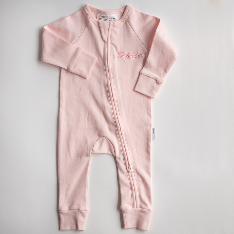 Cotton Pink Zip Onesie pink baby onesie with front zipper and pink embroidered name ‘Sophie.’