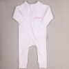 White Baby Onesie Amelia White baby onesie with front zipper and pink embroidered name ‘Amelia.’