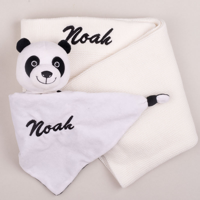 Personalised white knitted baby blanket with panda comforter.