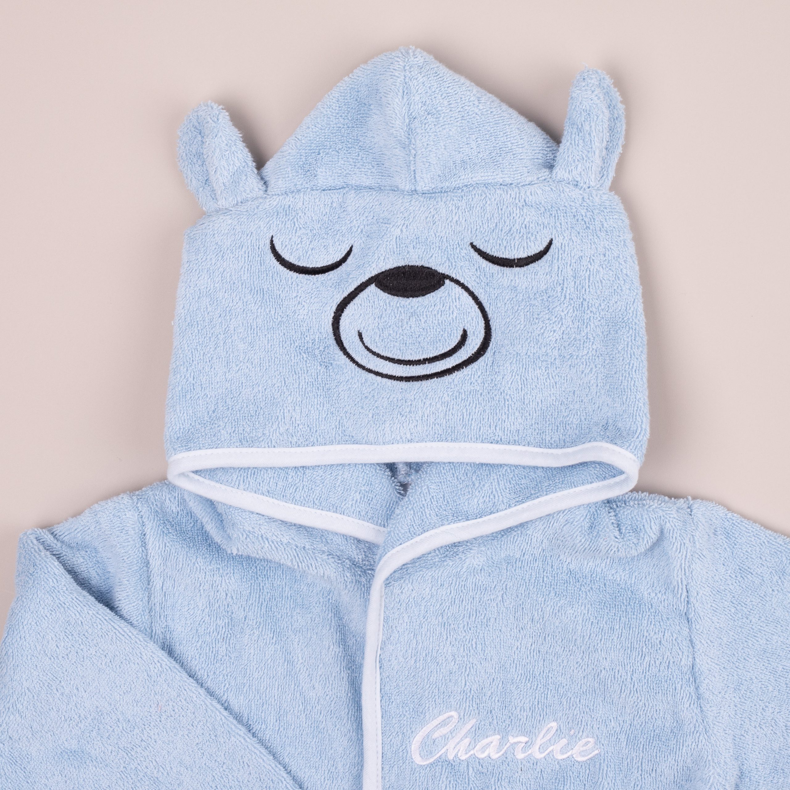 Blue bear hooded baby robe with embroidered face and ears.