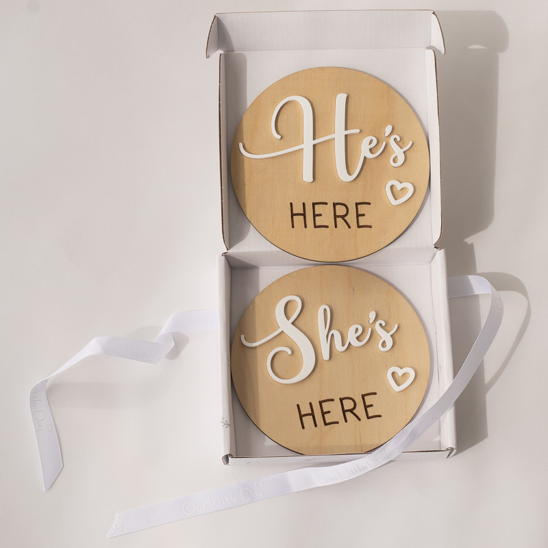 Wooden she’s here and he’s here birth announcement discs in gift box.