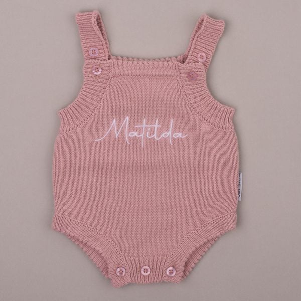 Blush Pink Baby Girl Romper With Name Matilda Blush pink knitted baby romper embroidered with the name βMatildaβ in white script.