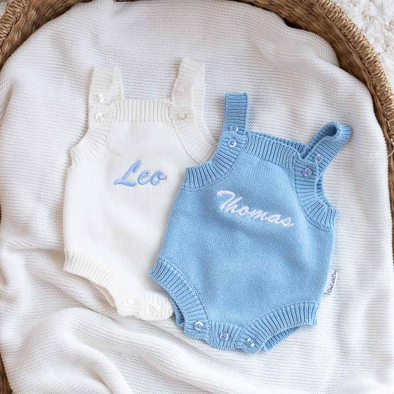 Blue and white personalised knitted baby boy rompers.