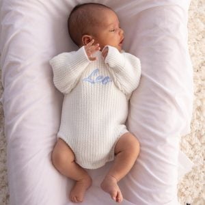 Personalised White Knitted Long Sleeve Baby Boy Romper embroider with the name, Leo.