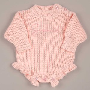 Personalised pink long sleeve knit baby romper with tone on tone name embroidery on chest and ruffle hem