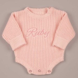 Personalised pink long sleeve knit baby romper with tone on tone name embroidery on chest and scallop edge hem
