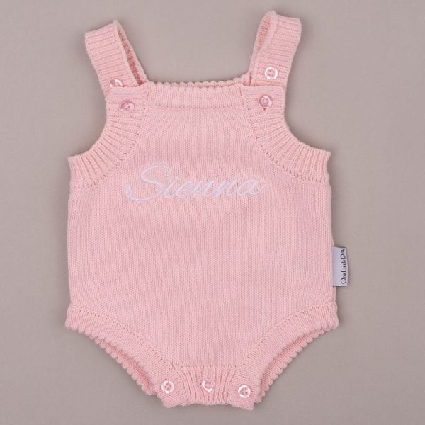 Pink Baby Girl Knitted Romper Scalloped Edge With Name Sienna Pink knitted baby romper with scalloped edge embroidered βSiennaβ in white script.