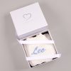 White Long Sleeve Baby Boy Romper Gift Box Personalised white chunky knit baby boy romper with blue embroidered name presented in a One Little Day gift box