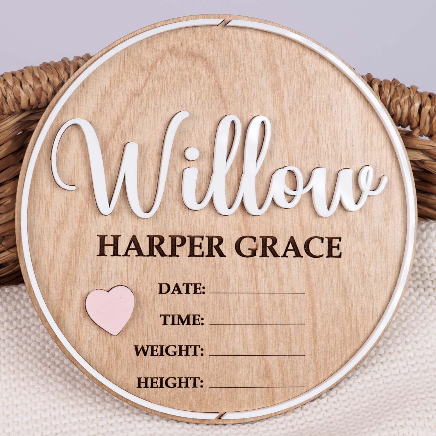 Personalised round wooden nursery plaque with Willow in white and Harper Grace engraved with pink heart and birth detail fields