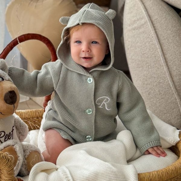 A Baby Wearing our Personalised Green Sage Hooded Cardgian.