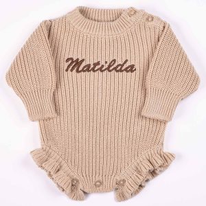 Personalised beige chunky knit long sleeve frilly baby girl romper with brown embroidered name and ruffle hem
