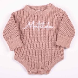 Personalised blush pink chunky knit long sleeve baby romper with white embroidered name and button shoulders