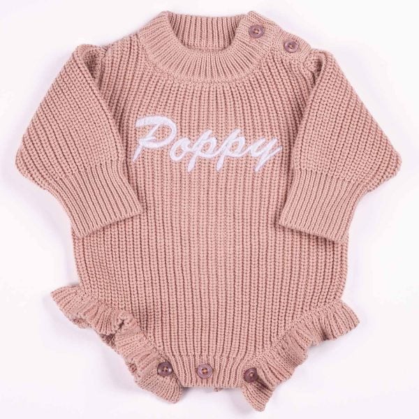 Blush Pink Long Sleeve Frill Baby Romper Poppy Name Personalised blush pink chunky knit long sleeve frilly baby girl romper with white embroidered name and ruffle hem