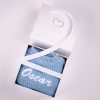 Long Sleeve Blue Baby Romper Gift Box Oscar Personalised blue chunky knit baby romper with white embroidered name presented in a One Little Day gift box