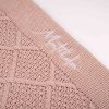 Pink & Gold Diamond Knitted Baby Blanket Close Up Matilda Close-up of personalised pink and gold diamond knit baby blanket with white name embroidery on border