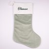 Sage Green Baby Christmas Stocking Thomas Personalised sage green velvet baby Christmas stocking with dark green Thomas embroidery on white cuff