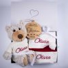 4 Piece Personalised Bear & Disc Christmas Baby Gift Gift Box Four piece personalised Christmas baby gift set including grey plush teddy bear, burgundy velvet stocking, Santa hat and wooden My First Christmas disc presented together in an open One Little Day gift box with white ribbon bow.