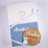Blue Diamond Knit And Bear Boy Birth Announcment Disc. Gift Box Blue diamond knitted personalised baby blanket and wooden bear birth announcement disc with blue acrylic bear presented together in an open One Little Day gift box with white ribbon bow.